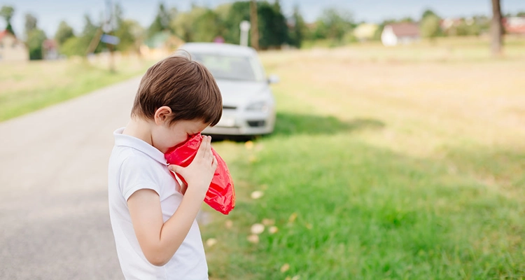Children feeling unwell while traveling, showcasing discomfort and concern during a trip