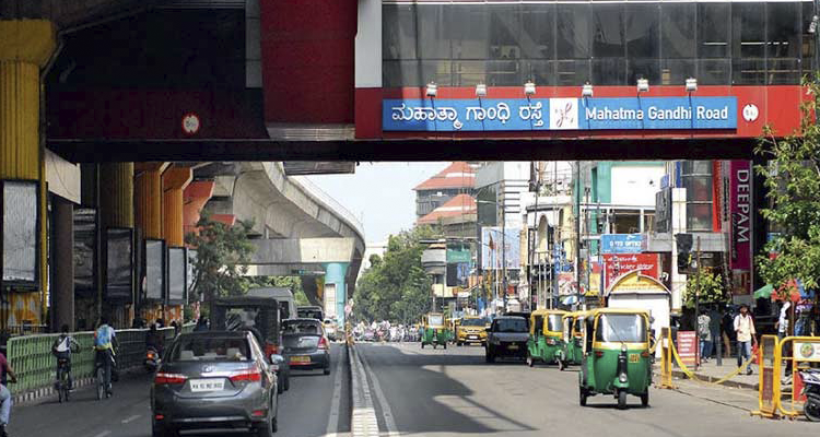 Traffic & metro bridge at Mahatma Gandhi Road, a lively shopping & business hub in Bangalore